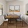 a dining room with a table and chairs