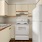 a kitchen with white cabinets