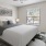 a bedroom with a bed and a fan